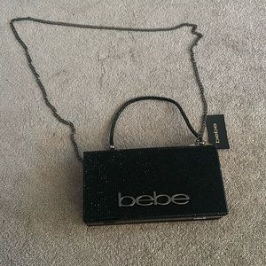 Bebe clutch with shoulder and hand strap